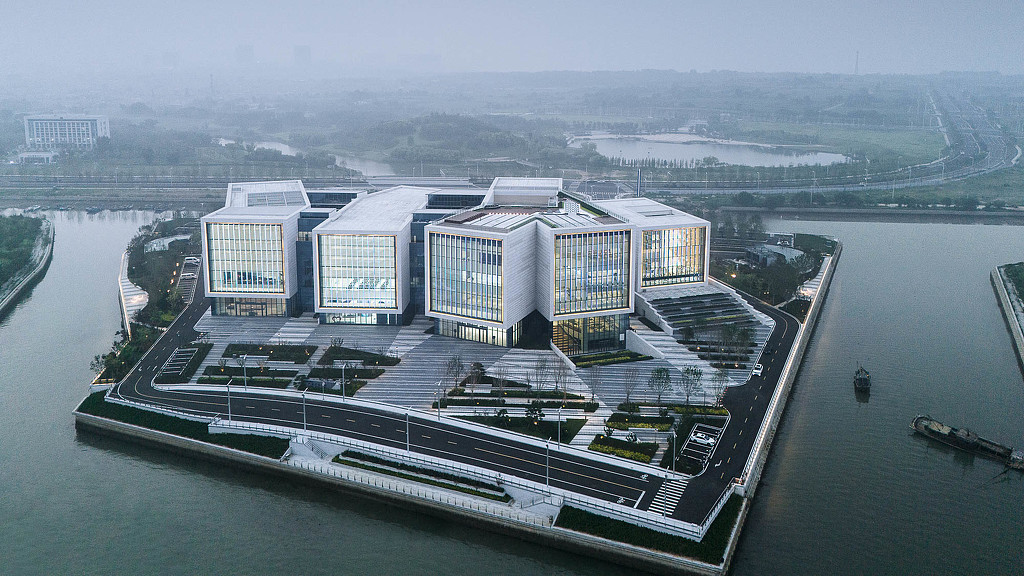 High angle of a building with a large glass front.